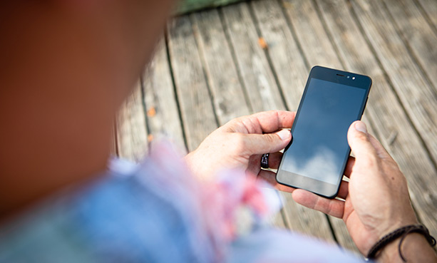 man looking at his phone