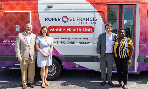 Scott Farfone and his wife in front of mobile health unit