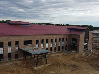 Sawmill building south side brick progress thumbnail